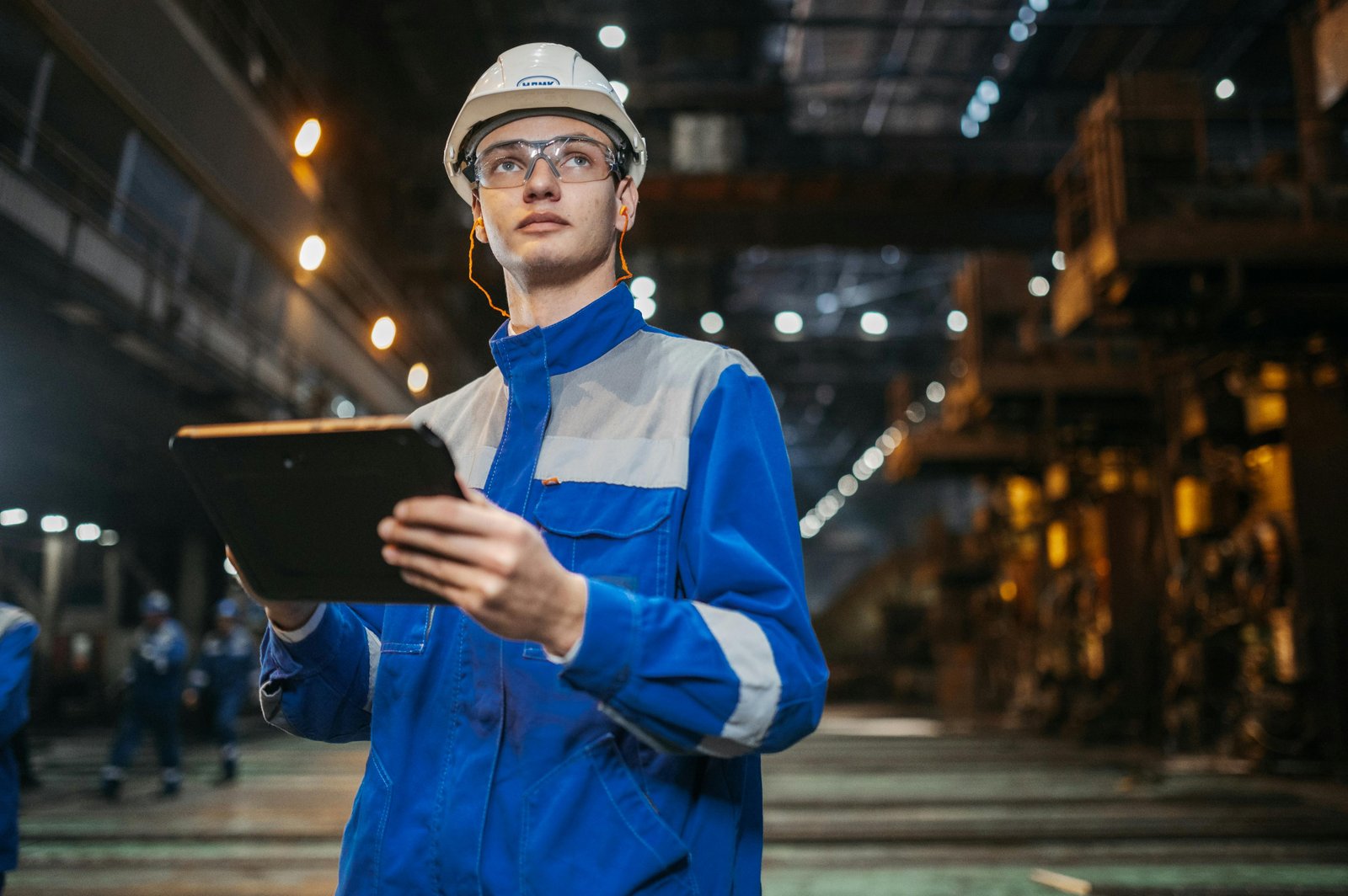 Industrial engineer with tablet inside a facility